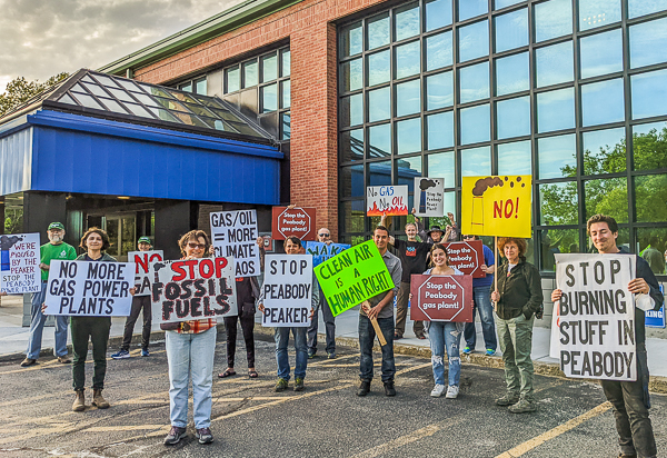 Demonstrators at the Peabody Municipal Light Plant during meeting of the commissioners