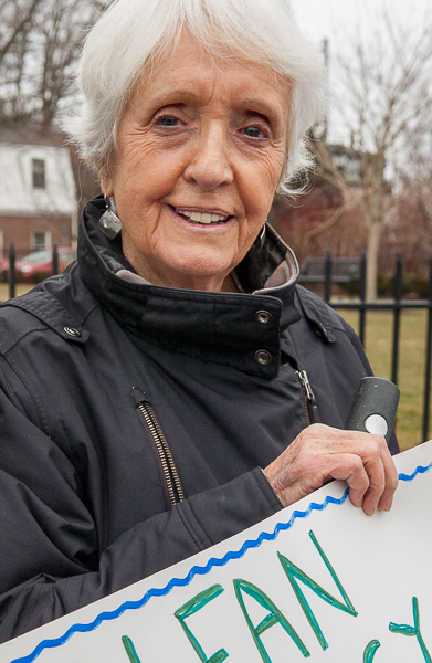 Woman holding sign