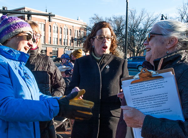 Woman chats with L/R Senator Lovely, Representative Kerans, and Susan Smoller of Breathe Clean North Shore