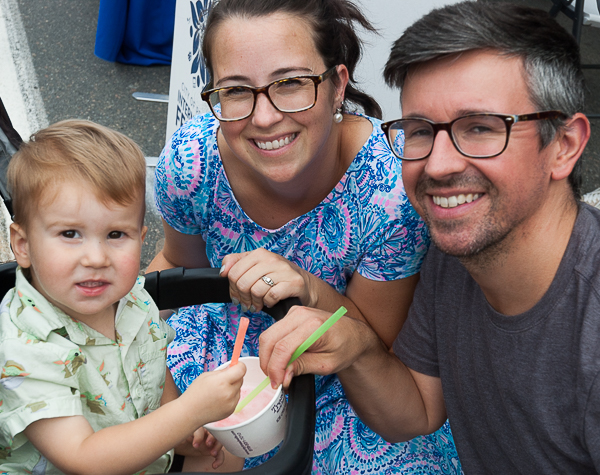 Parents and child, enjoying snack