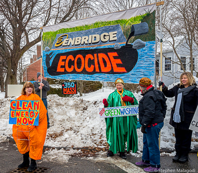 Woman in baloon costume, "Methane Linda," and sign holders