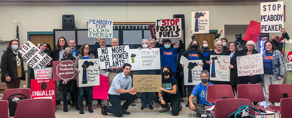 Group of people holding signs