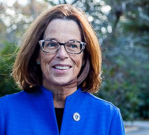 Sally Kerans: woman wearing blue jacket outdoors