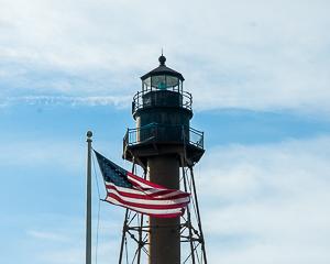 Marblehead lighthouse, with American flag in foreground