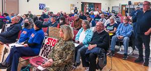 Rows of seated people at hearing