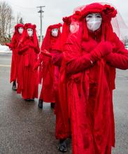 Red rebels, several figures in red robes and hats