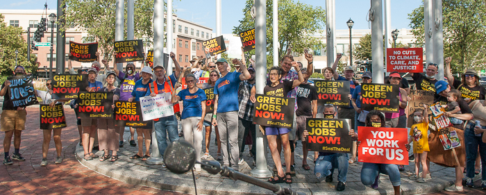 Demonstrators pose for news photographer