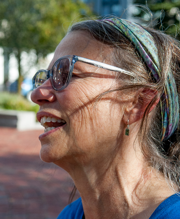 Woman, one of the performers who led singing