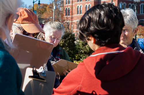 Mireille Beijani helps a group prepare to canvass a neighborhood.