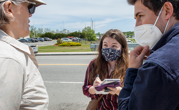 Reporters are a great help in educating the public. Caroline Enos interviews a demonstrator and Logan Malik