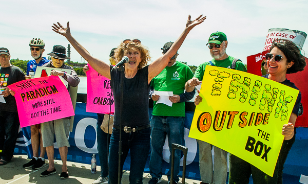 Bobbie Wayne leads singing of "Think outside the box."