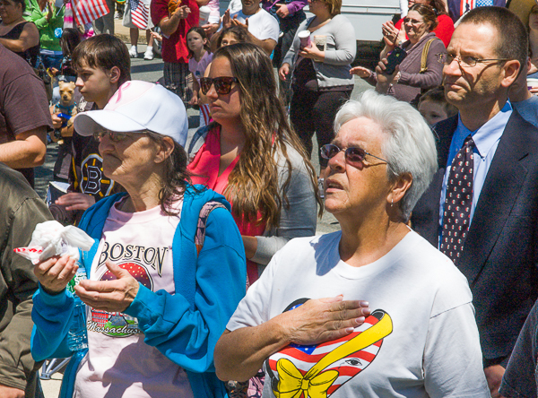 Woman and city councilor salute