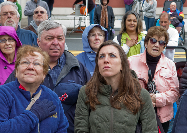 People watching raising of the flag