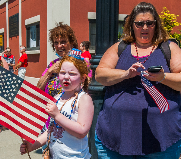 Women and child watching Memorial Day parade