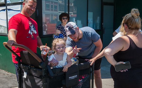 Family and baby watch Memorial Day parade