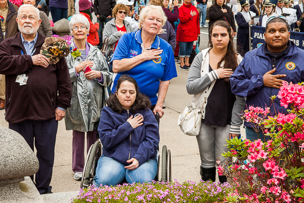 People watching raising of the flag