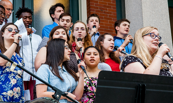Chorus performing at interfaith gathering, City Hall