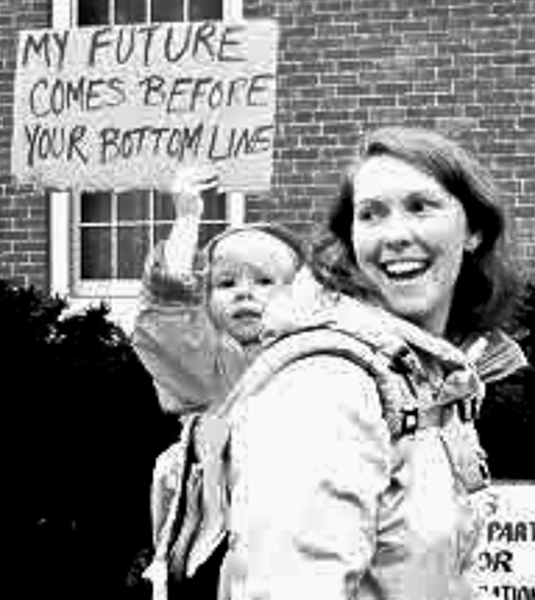Mother and child holding sign