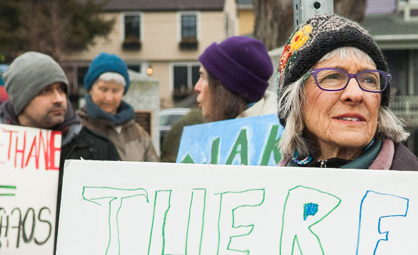 Woman holding sign