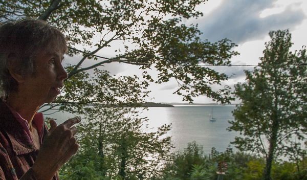 Judeth Van Hamm gestures against background of ocean