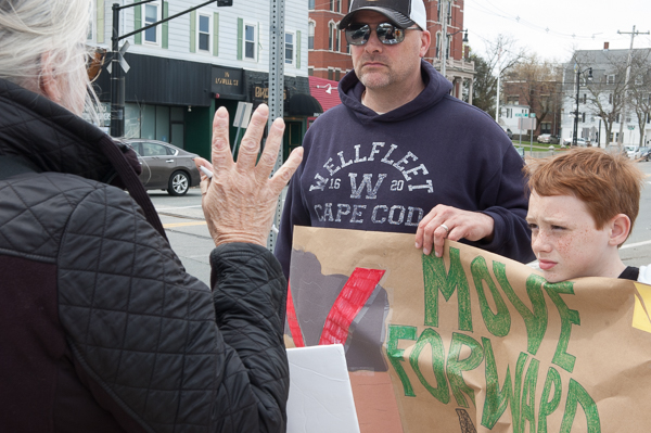 Susan Smoller talks with two demonstrators