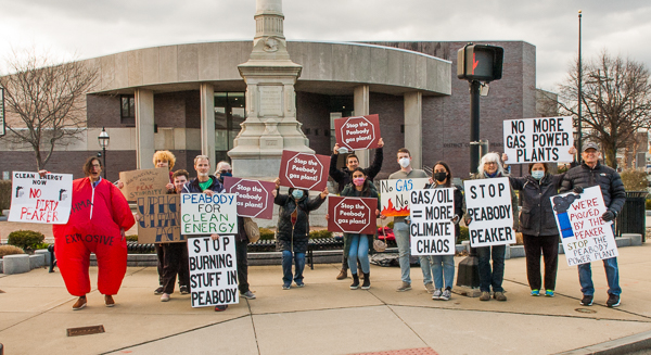 Most of the demonstrators holding signs