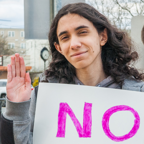 Young person at standout against peaker plant