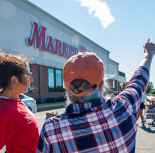 At the Market Basket in Danvers, Susan Smoller points out to Judith Smoller the smokestack at site of proposed peaker plant