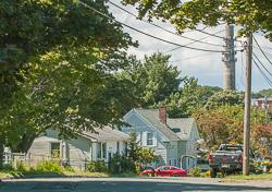 Homes close to smokestack that adjoins site of new peaker plant