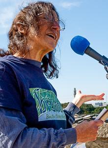 Judith Black speaks to the die-in rally at Danversport Bridge